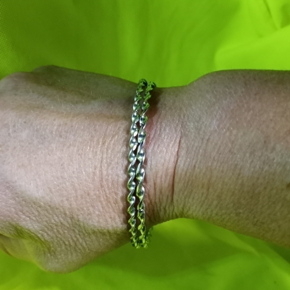 Pair of Silvertone twisted Bangle bracelets